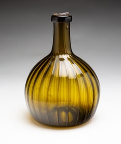 FINE ZANESVILLE RIBBED BLOWN GLASS BOTTLE WITH UNUSUAL COLOR.