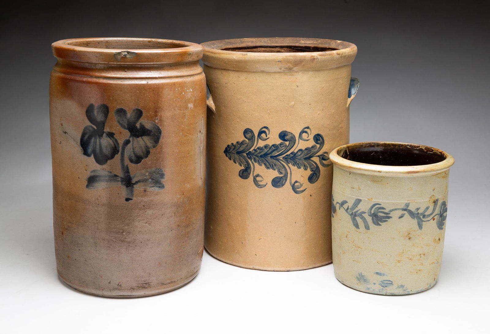 THREE COBALT DECORATED SALT GLAZED STONEWARE JARS. (1 of 6)