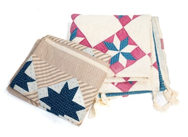 TWO QUILTS IN EIGHT POINTED STAR PATTERNS.