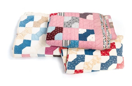 THREE QUILTS IN THE BOWTIE PATTERN.