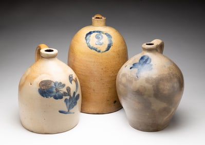 THREE COBALT DECORATED SALT GLAZED STONEWARE JUGS.