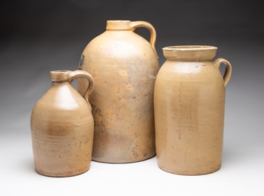 THREE SALT GLAZED STONEWARE JUGS.
