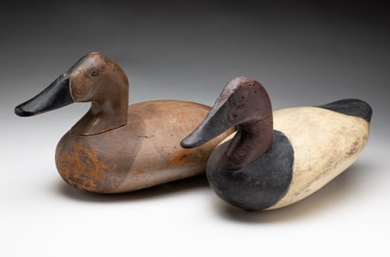 TWO CARVED AND PAINTED WORKING DUCK DECOYS.
