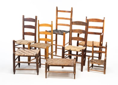 SIX LADDER BACK CHAIRS AND TWO OTTOMANS.
