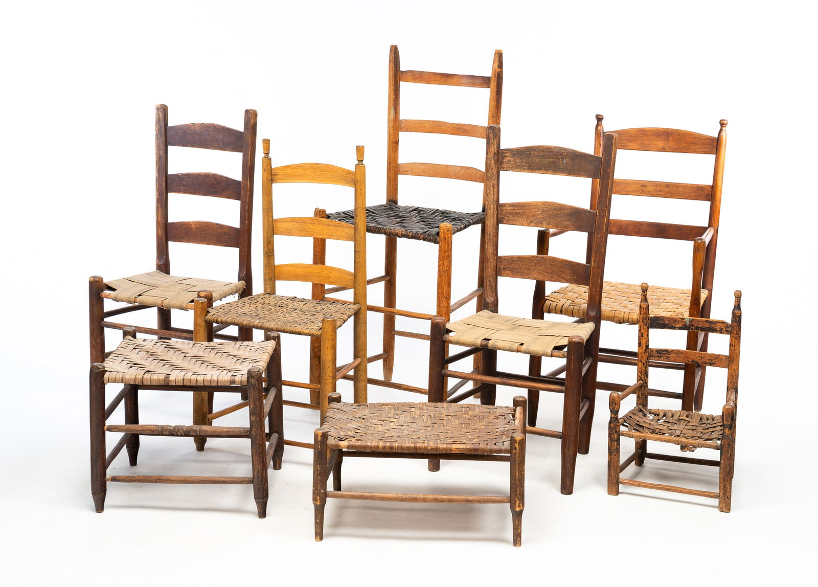 SIX LADDER BACK CHAIRS AND TWO OTTOMANS. (1 of 7)