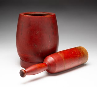 RED PAINTED MORTAR AND PESTLE.