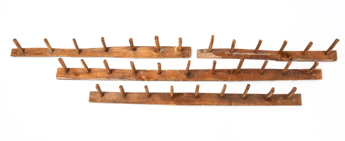 FOUR PRIMITIVE PINE PEG RAILS.
