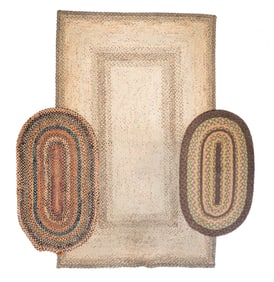 THREE BRAIDED RUGS.