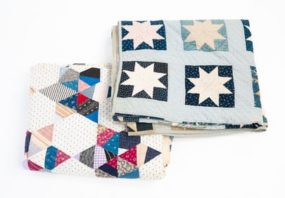 TWO QUILTS IN STAR PATTERNS.