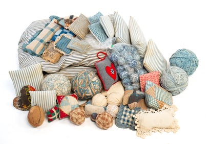 LARGE COLLECTION OF RAG BALLS, PIN CUSHIONS, AND PILLOWS.