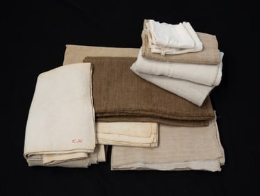 GROUP OF EARLY HOMESPUN, LINEN, AND BURLAP FABRICS.