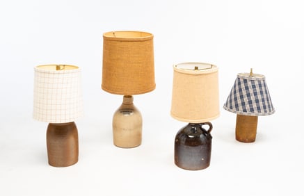FOUR ELECTRIFIED STONEWARE LAMPS.