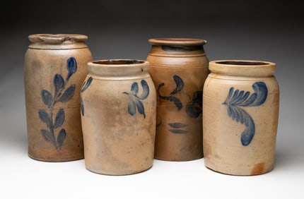 FOUR COBALT DECORATED SALT GLAZED STONEWARE JARS.