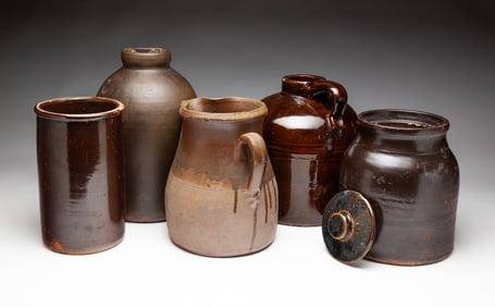 FIVE BROWN GLAZED STONEWARE ITEMS.