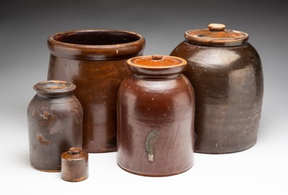FIVE BROWN GLAZED STONEWARE ITEMS.