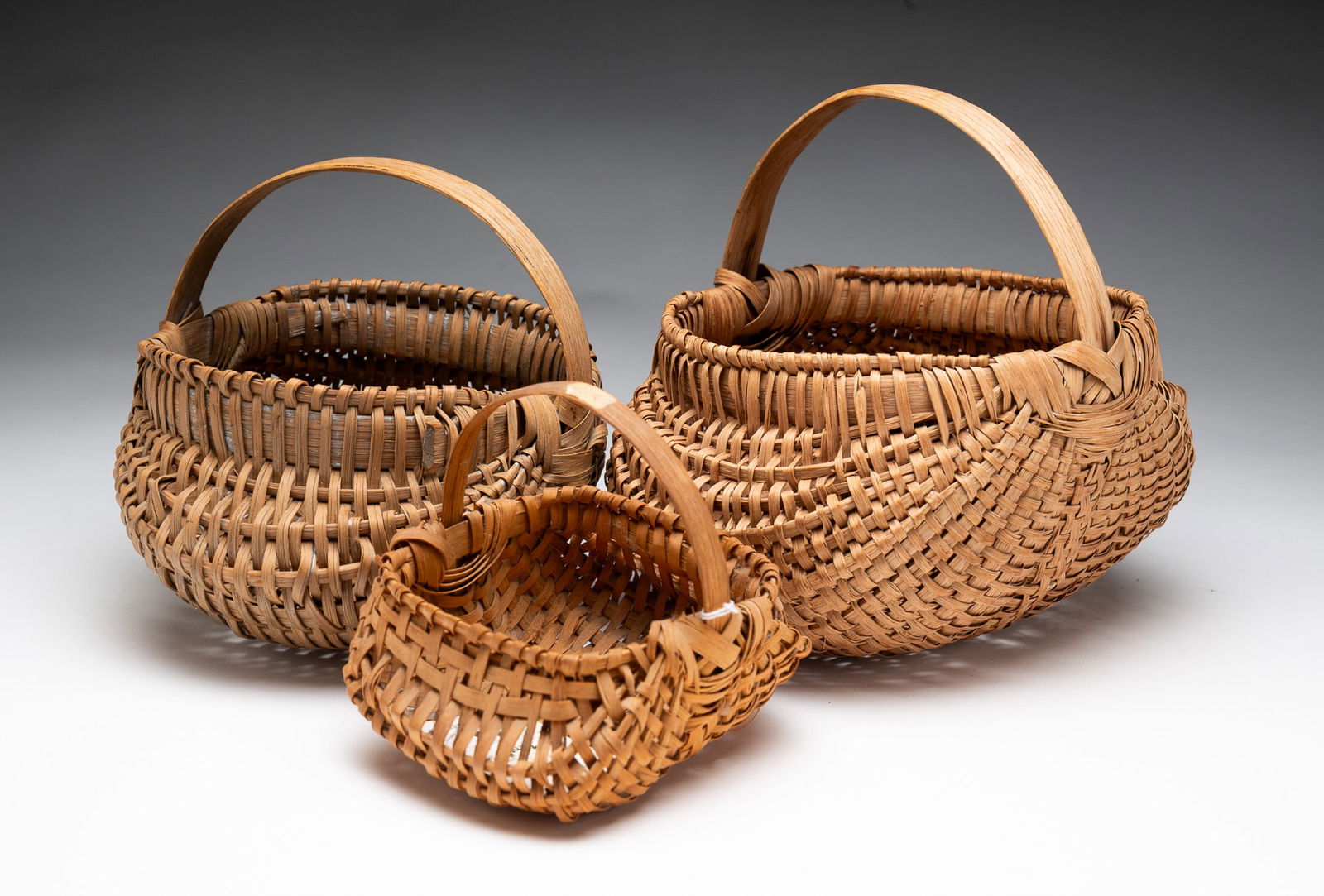 THREE SPLINT BASKETS. (1 of 4)