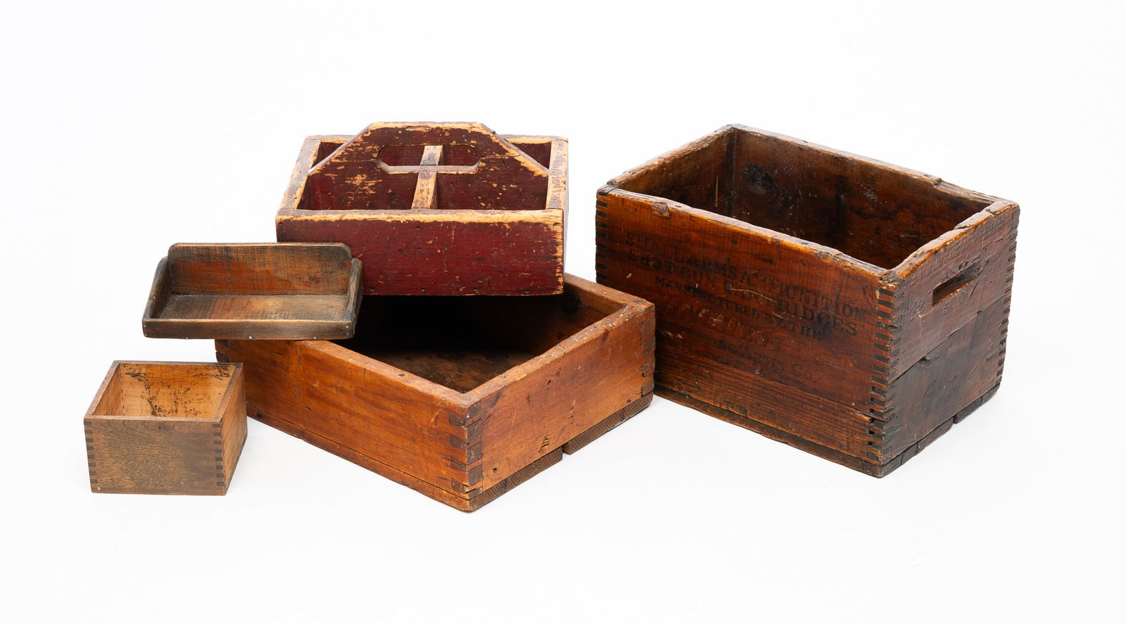 FIVE WOOD BOXES.: American, 19th/20th Century. Comprising a Winchester ammunition box with finger joints, an open box with dovetail joints, a red painted divided carrier, a diminutive box with finger joints, and an ope