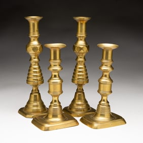 TWO PAIRS OF BRASS CANDLESTICKS.