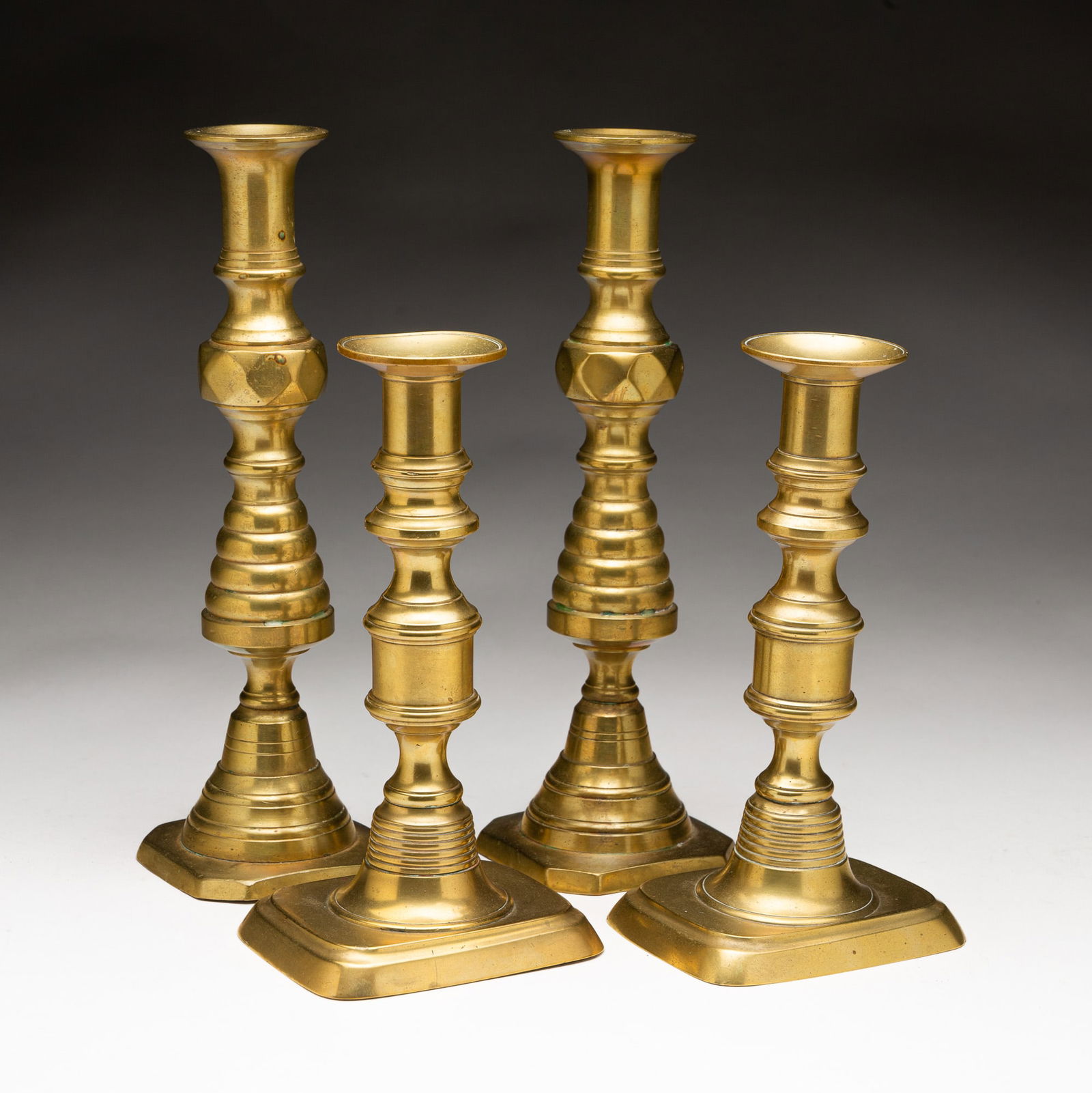 TWO PAIRS OF BRASS CANDLESTICKS. (1 of 5)