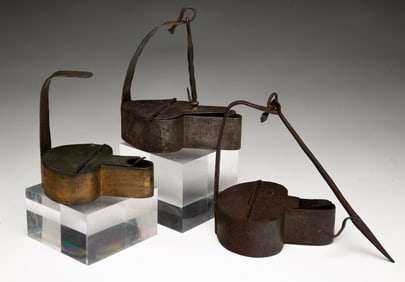 THREE IRON BETTY LAMPS.