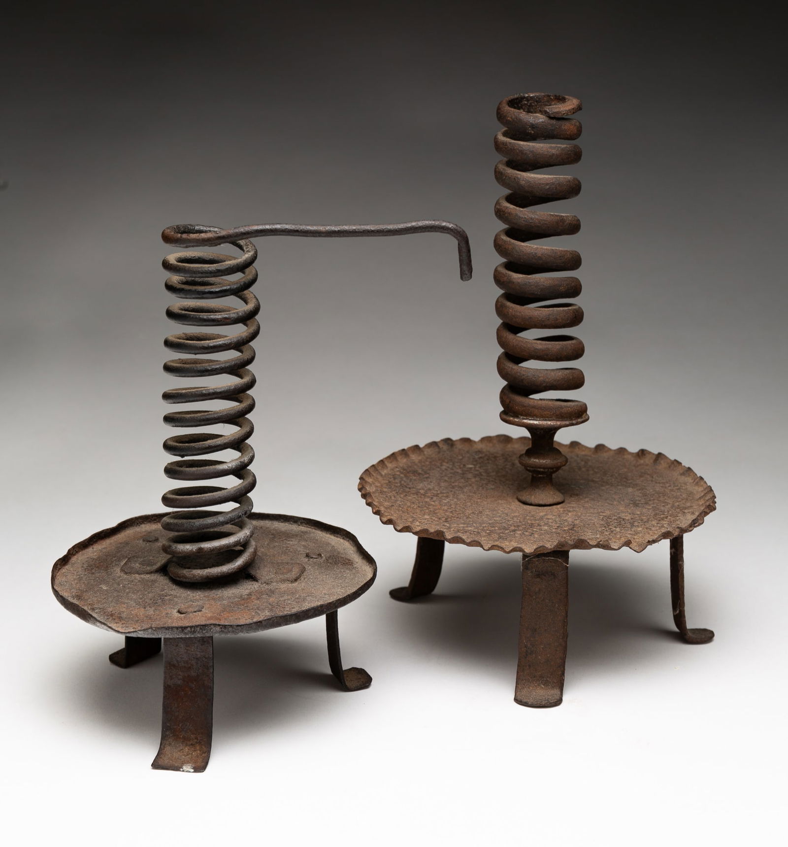 TWO WROUGHT IRON SPIRAL CANDLESTICKS. (1 of 4)
