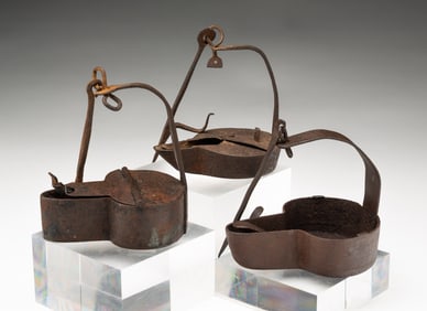 THREE IRON BETTY LAMPS.