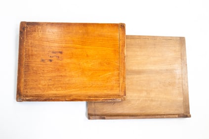 TWO SLANTED BREAD BOARDS.
