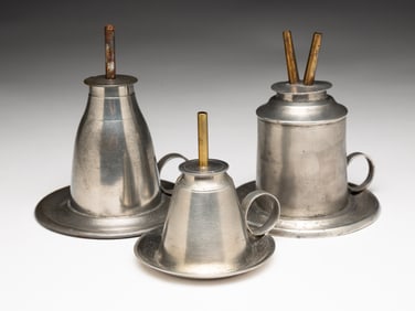 THREE PEWTER FLUID BURNING LAMPS.