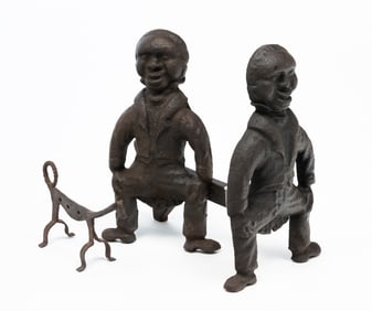 PAIR OF CAST IRON BLACKAMOOR ANDIRONS AND AN IRON ANIMAL.