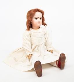 LARGE FRENCH BISQUE HEAD DOLL WITH CORK PATE AND WIG.