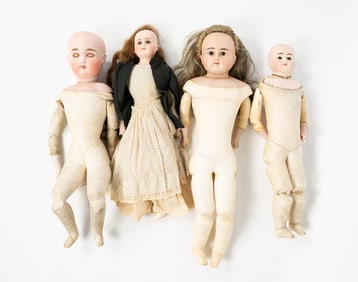 FOUR BISQUE HEAD FASHION DOLLS.