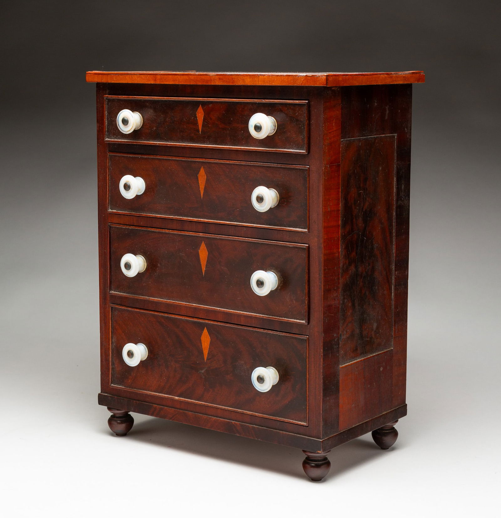MINIATURE FOUR DRAWER INLAID MAHOGANY CHEST. (1 of 5)