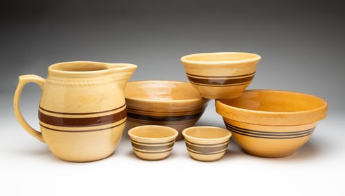FIVE YELLOWWARE BOWLS AND A PITCHER.