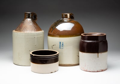 FOUR TWO TONE GLAZED STONEWARE VESSELS.