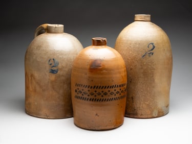 THREE STONEWARE JUGS.