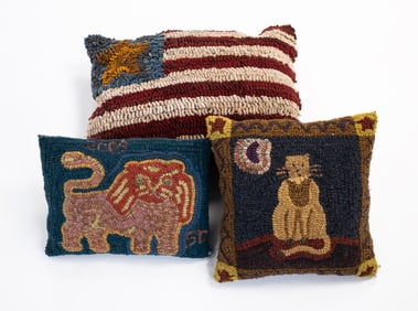 THREE HOOKED THROW PILLOWS.