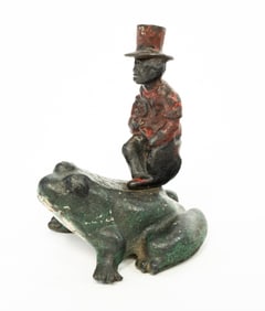 PAINTED FROG AND RIDER DOORSTOP.