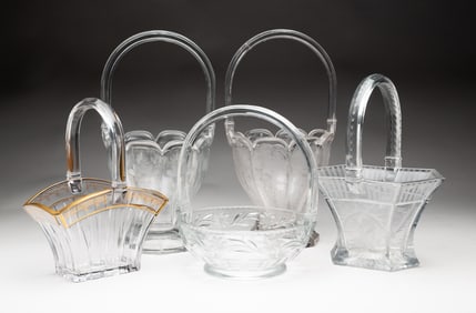FIVE SIGNED HEISEY CLEAR GLASS BASKETS.