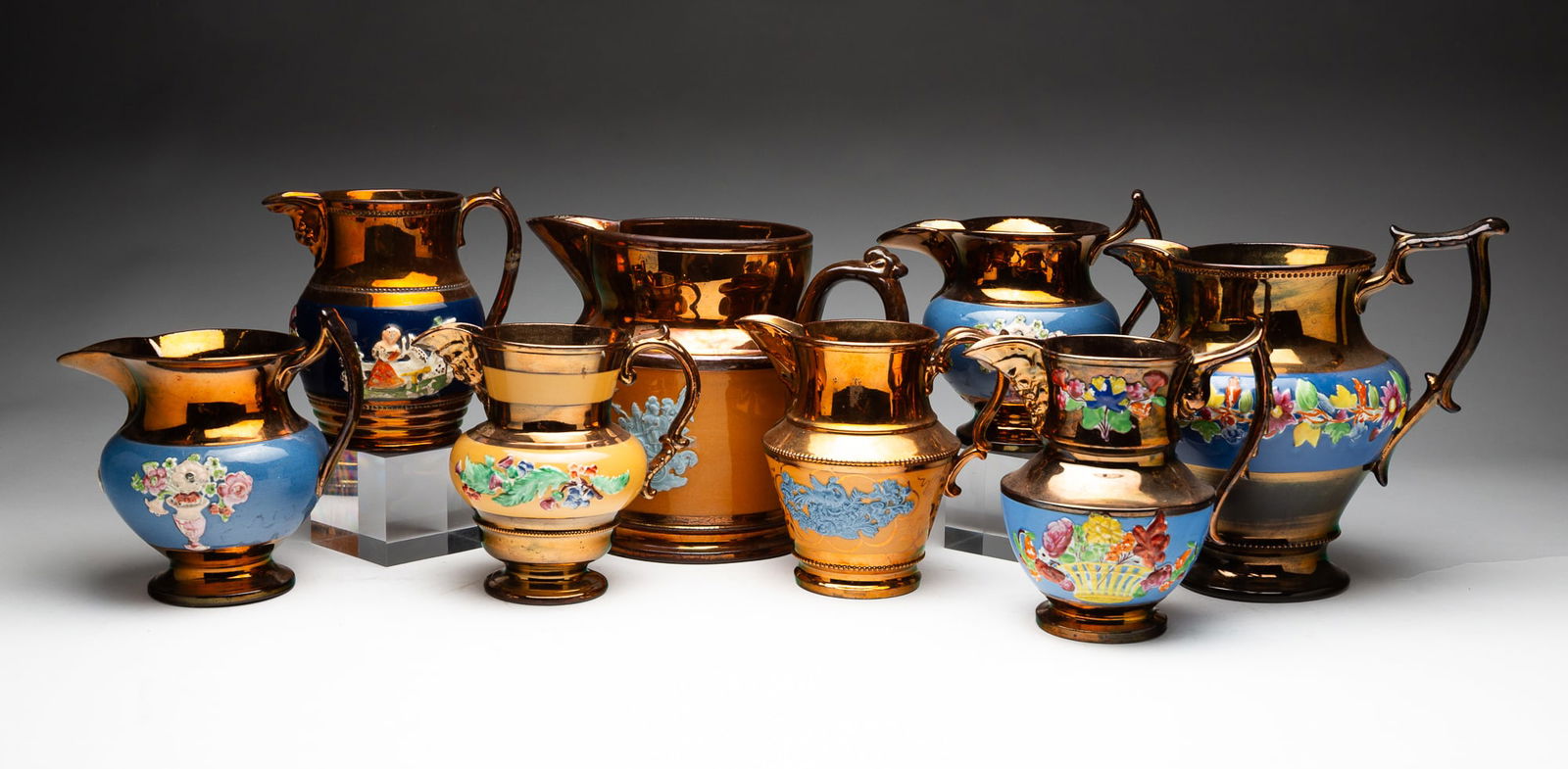 EIGHT COPPER LUSTER PITCHERS. (1 of 7)