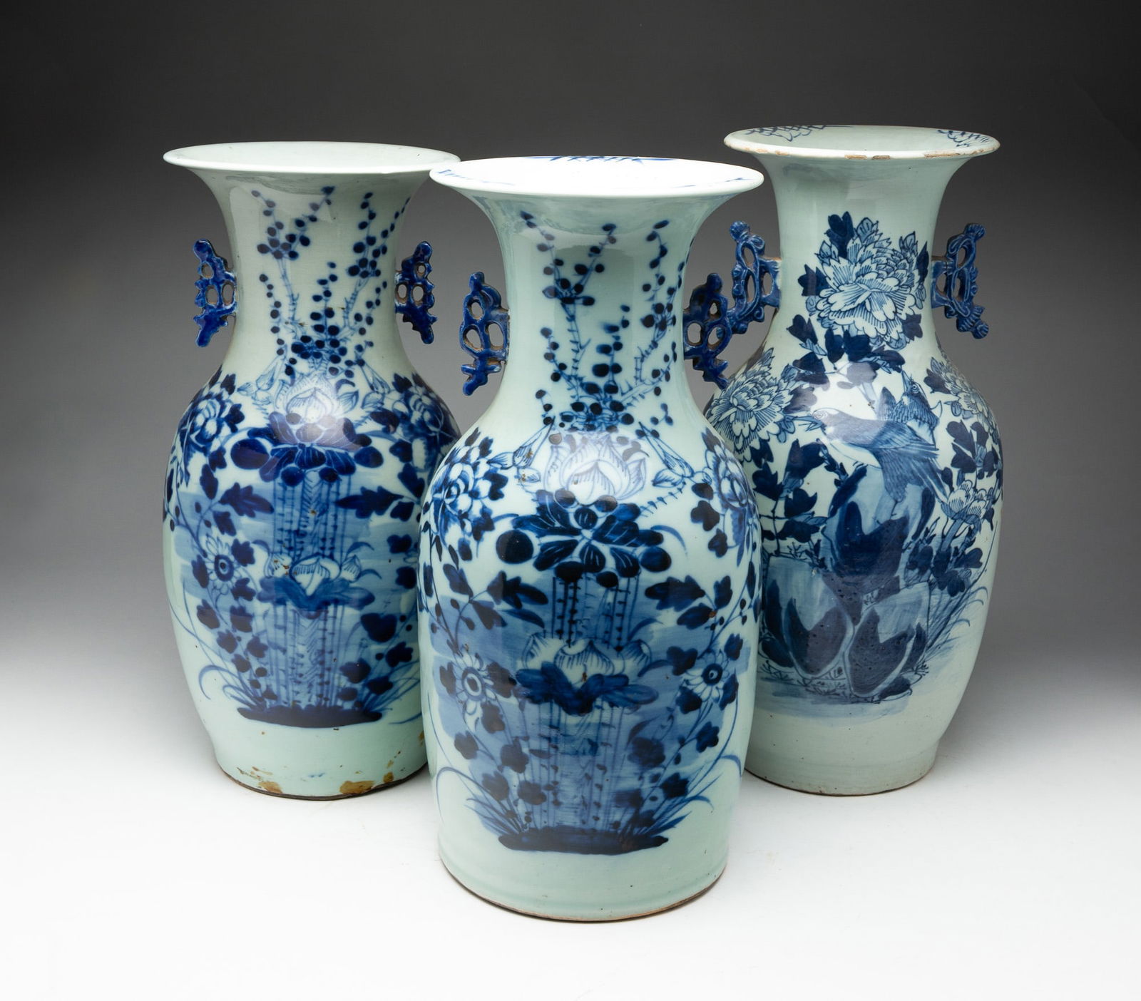 THREE CELADON VASES WITH COBALT DECORATION. (1 of 8)