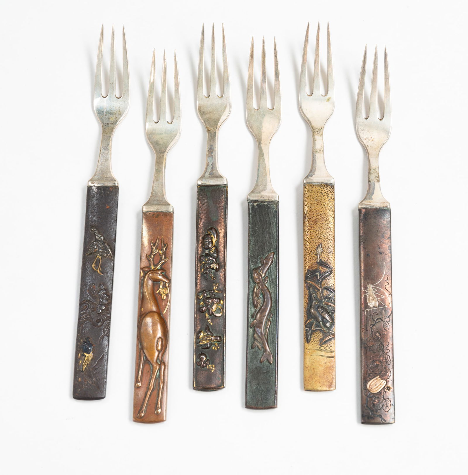 SET OF SIX ASAHI SHOTEN MIXED METAL FORKS.