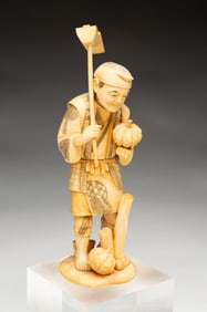 JAPANESE CARVED OKIMONO FIGURE.