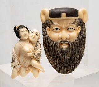 JAPANESE CARVED SHUNGA OKIMONO MASK AND FIGURE.