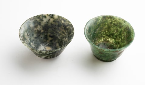 TWO VINTAGE CARVED SPINACH JADE WINE CUPS.