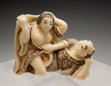 JAPANESE CARVED SHUNGA OKIMONO FIGURE.