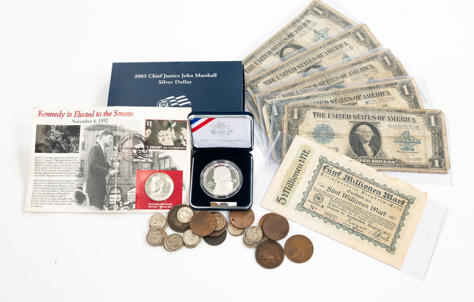 GROUPING OF US AND FOREIGN CURRENCY.: Worldwide, 20th Century. Including nine blue seal silver certificates, a 2005 Chief Justice John Marshall silver dollar, 1968 Kennedy half dollar, assorted Mercury head dimes, Indian head cents, Canad