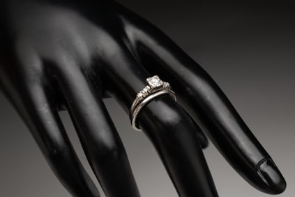 PLATINUM AND DIAMOND WEDDING RING SET.