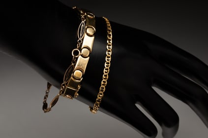 THREE 14K YELLOW GOLD FANCY LINK BRACELETS.