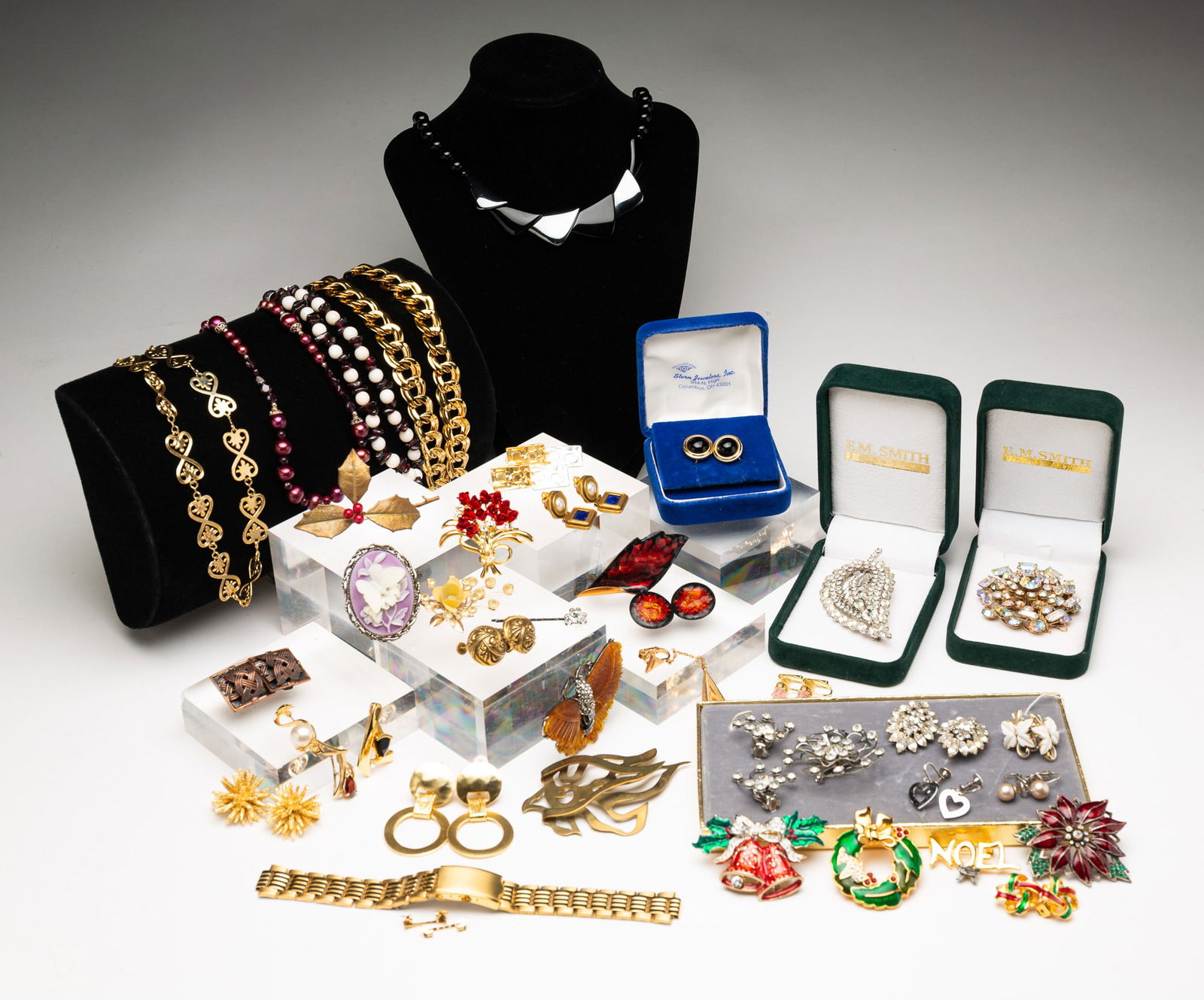 GROUP OF COSTUME JEWELRY.: Contemporary. Includes necklaces, brooches, earrings and pendants. Featuring items from MMA and a pair of Coro earrings.