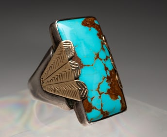 NATIVE AMERICAN OLD PAWN SILVER AND GOLD TURQUOISE RING.